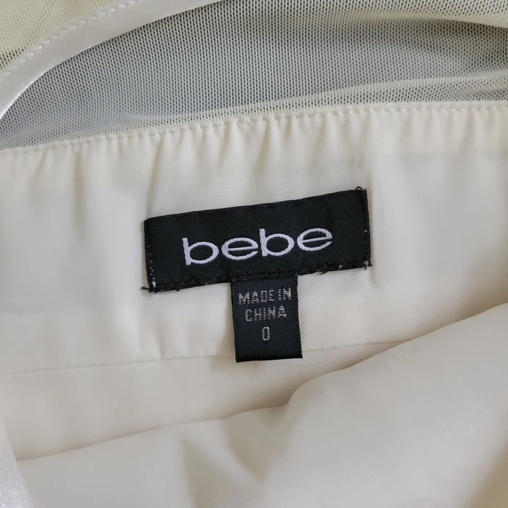 Bebe | Cute Ivory Pleated Sleeveless Fit & Flare Cocktail Dress - Picture 5 of 15